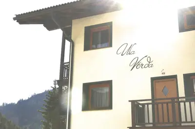 a building with a sign on the side of it at Villa Ula Verda- Apartments Marianna in Santa Cristina in Val Gardena