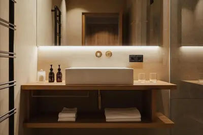 a bathroom with a sink and a mirror at Waldrast - Forestside Living in Siusi