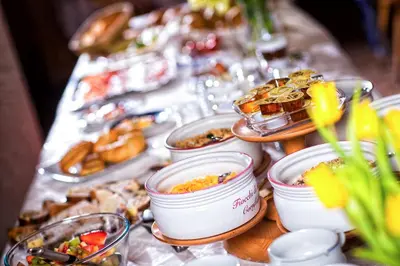 a table topped with bowls of food and other foods at Solaia Hotel & Guesthouse in Castelrotto