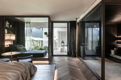 a bedroom with a bed and a living room at SILENA, your soulful hotel - adults only in Valles