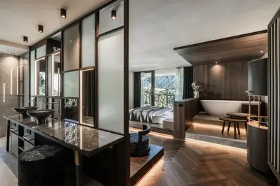 a bathroom with a tub and a bedroom with a bed at SILENA, your soulful hotel - adults only in Valles