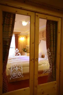 a bedroom with a bed in a room at Hotel Bellavista in Canazei