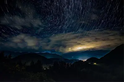 a night sky with star trails in the mountains at Natur Apartments Riesen in San Lorenzo di Sebato