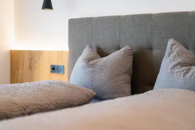 a close up of a bed with pillows on it at Beim Lackl in Avelengo