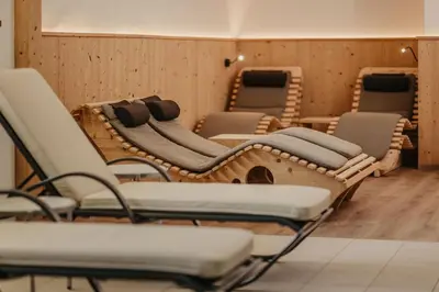 a row of empty chairs in a waiting room at Hotel Castel Oswald von Wolkenstein in Castelrotto