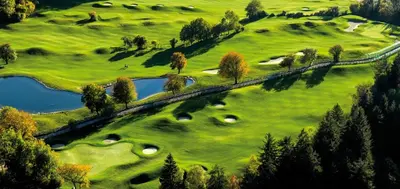 a realistic painting of a golf course with a lake at Hotel Castel Oswald von Wolkenstein in Castelrotto