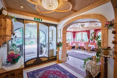 an entry way to a home with a living room at Alpenhotel Schönwald Superior in Valles