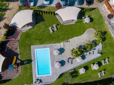 an overhead view of a yard with a swimming pool at Landsitz Stroblhof in Tirolo