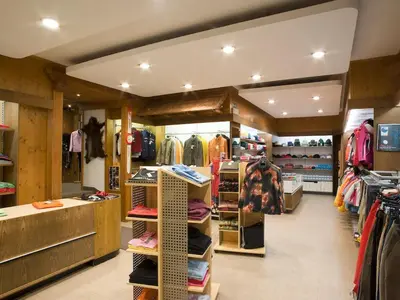 a store filled with lots of racks of clothes at Residence Rottonara in Corvara in Badia