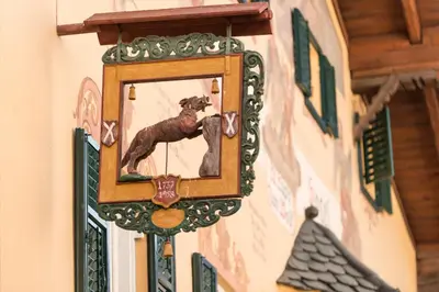 a picture of a dog on the side of a building at Hotel zum Wolf in Castelrotto