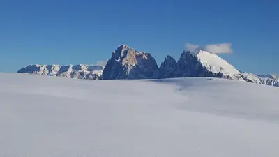 a snow covered mountain in the middle of a desert at Hotel Alpenroyal in Castelrotto
