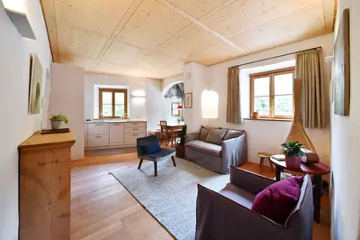 a living room with a couch and a table at Casa Piganò in Appiano sulla Strada del Vino