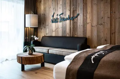 a living room with a couch and a table at Hotel Arkadia - 