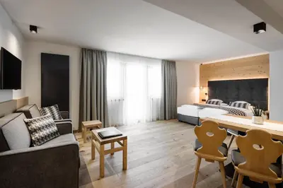 a living room with a couch and a table at Hotel Arkadia - 