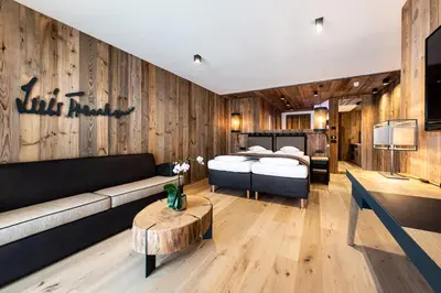 a living room with a bed and a couch at Hotel Arkadia - 