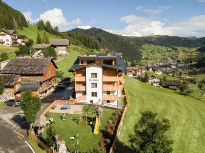 an aerial view of a village in the mountains at Declara B&B and apartaments in Colfosco