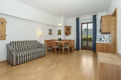 a living room with a couch and a table at Appartements Eppanerhof in Appiano sulla Strada del Vino