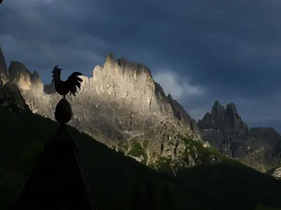 a statue of a horse on top of a mountain at Albergo Centrale in San Martino di Castrozza