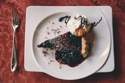 a plate of food with dessert on a table at Albergo Centrale in San Martino di Castrozza