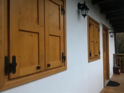a room with wooden doors on a wall at Casa Lausen in Canale San Bovo