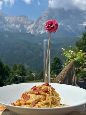 a table with many different types of pies and pastries at HG Hotel La Caminatha in Val di Zoldo
