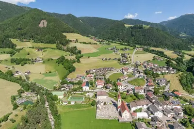 an aerial view of a village in the mountains at Hotel Rosental in Luson