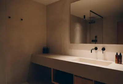 a bathroom with a sink and a mirror at Forestis Dolomites in Bressanone