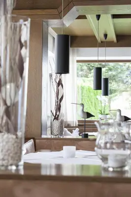 a dining room with a table and a window at Hotel Tirolerhof in Rodengo