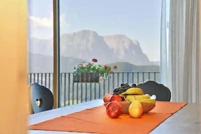 a plate of fruit on a table with a view at Anger living in Laion