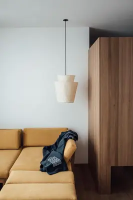 a couch with a jacket sitting on top of it at Haus am Turm in Vipiteno
