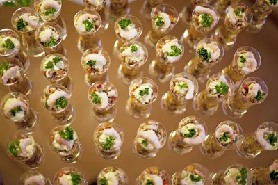 a display of small glass dishes filled with food at Beauty & Vital Hotel Maria in Carano