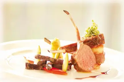 a plate of food with meat and vegetables on it at Hotel Stefanshof in Plaus