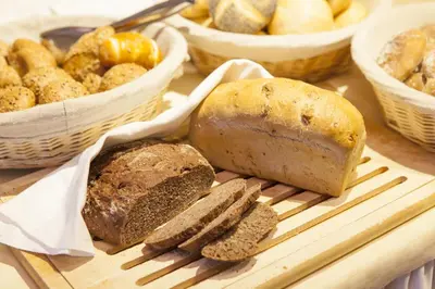 a cutting board with bread and other foods on it at Hotel Stefanshof in Plaus