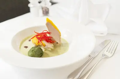 a plate of food on a white table at Hotel Stefanshof in Plaus