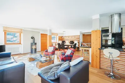 a living room with a couch and a table at Casa Zilli in La Villa