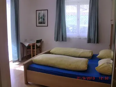 a bed with two pillows on it in a room at Dillerhof in Laion