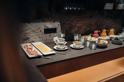 a buffet line with food on a table at Plan Murin - Authentic Dolomites Hotel in La Valle