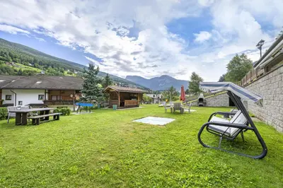 a yard with a playground with a picnic table at Apartments Mirandula in Ortisei