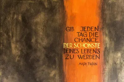a painting of an orange object with writing on it at Residence Mignon in Rifiano