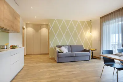 a living room with a couch and a table at Appartments Waage in Bressanone