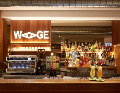 a bar with a wcge sign on the wall at Appartments Waage in Bressanone