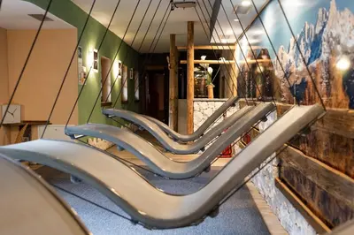 a row of seats in a waiting room at Hotel Scoiattolo in Tesero