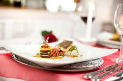 a plate of food on top of a table at Panorama Vital Hotel Rimmele in Tirolo