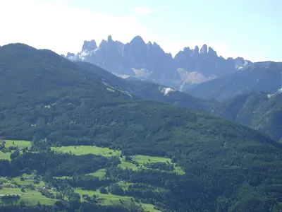 a view of a green valley with mountains at Zehrehof in Bressanone
