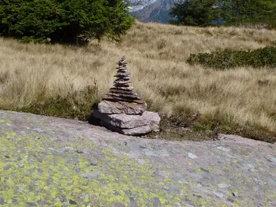 a stack of rocks on a field of grass at Reiterhof Edelweiss in San Genesio Atesino