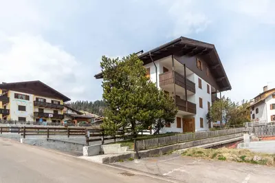 a building on the side of a road at Chalet Catinaccio in Soraga