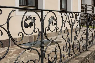 a wrought iron fence in front of a building at Casa Matie in Selva di Val Gardena