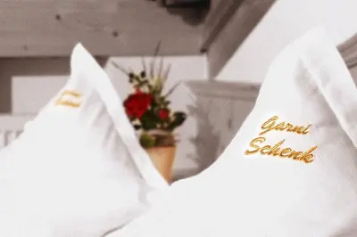 a white shirt with the words dean school on it at Garni B&B Schenk in Selva di Val Gardena