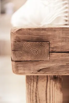 a close up of the wood of a bench at Mountain Dolomiti Apartments-Maison Perrod in Predazzo