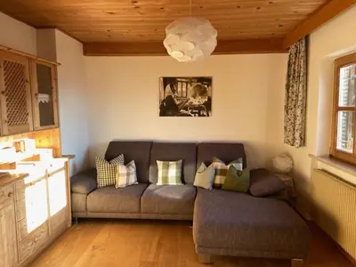 a living room with a couch and a table at Residence Streitlhof in Tirolo